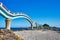 Beautiful scenic of Sanxiantai arch bridge with blue ocean with Three saint island in behind at Chenggong district