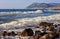 Beautiful scenic seascape of Black Sea by Bolshoy Utrish, Anapa, Russia with flock of sea gulls flying and waves breaking on sandy