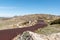 Beautiful scenic view of the rusty steel boardwalk connecting the summit of Mount Kosciuszko 2228m above sea level