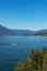 Beautiful scenic view of the white speedboat cruising along Lake Como, Italy.