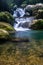 The beautiful scenic waterfall in front of famous double decker root bridge in meghalaya