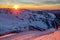Beautiful scenic winter mountain sunset landscape of snowy Caucasus Mountains and ski slope of Gorki Gorod mountain ski resort in