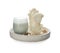 Beautiful sculptural candles and accessories on white background