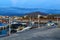 Beautiful sea with evening soft light of the sunset against cloudy sky with coastal line resort town, on Crete. Greece