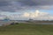 beautiful sea landscape at the dutch coast with a big cargo ship in the sea along the coast in winter