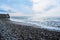 Beautiful sea landscape. Strong powerful sea waves break on shingle sea shore. Dangerous power of element of water