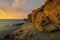 Beautiful sea landscape - sunset over a rocky ocean cliff.Punta Papagayo