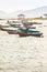 Beautiful sea, sand and fishing boats with mountain and blue sky