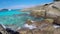 Beautiful Sea Waves Against Huge Rocks. Clear Blue Water at Similan Islands. HD GoPro Slowmotion. Thailand.