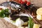 Beautiful seafood uncooked lobster closeup with lemon and herbs