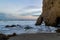 Beautiful seascape on the beach of Ed Matador in Malibu, California, a rock of unusual views against the ocean at sunset