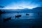 A beautiful seascape with boats and fishermen after sunset. deep blue tones