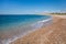 Beautiful seascape with calm sea, pebbles beach, blue sky of suburb in South Athens located in the Athens Riviera