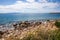 Beautiful seascape with calm sea, pebbles beach, blue sky of suburb in South Athens located in the Athens Riviera