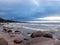 Beautiful seascape, dark clouds and white waves