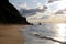 Beautiful seascape. Empty sandy beach, rock and waves of Pacific Ocean.