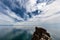 Beautiful seascape with Lake Baikal and incredible amazing sky with clouds