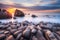 Beautiful seascape with long exposure of rocks and sea at sunset