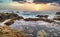 Beautiful seascape, ocean views, rocky coastline, sunlight on the horizon. Composition of nature. Sunset scenery