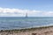 Beautiful seascape. Sailboat floats on the blue sea.