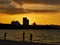 beautiful seascape scenery with three girls during sunset at Tanjung Lipat beach,Sabah.