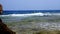 Beautiful seascape. small surf waves with white foam, breaking on rocky beach of the Red Sea. summer scenic seascape