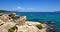 Beautiful seascape with stones and translucent blue water