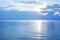 Beautiful seascape, sun glow reflection on blue sea water, morning sunrise, ocean beach sunset, sunny summer day, dawn landscape