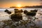 Beautiful seascape during sunset with motion waves at Klayar Beach, Indonesia