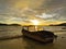 Beautiful seascape view with a boat during sunset at Kota Belud beach,Sabah.