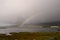 Beautiful seascape view with stunning rainbow in Scotland