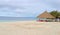 Beautiful seascape of white sand beach with colorful seats in the nice gazebo in cloudy day at Bohol island, Philippines