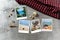 Beautiful seaside snapshots arranged on rustic wooden background with seashells around