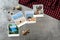 Beautiful seaside snapshots arranged on rustic wooden background with seashells around