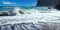 Beautiful secluded black lava sand beach bay, rocks, big strong splashing waves, blue sky - Caleta playa Hermigua, La Gomera