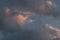 beautiful section of cloud filled sky at golden hour showing blue, grey, gold, yellow and orange hues at sunset during Australian