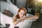 Beautiful seductive young red-haired lady with bare shoulders in bathtub.