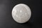 Beautiful selenite sphere mineral on dark background