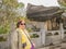 Beautiful senior asia women with Stone look like shell on tianmen mountain national park at zhangjiajie city china.