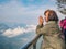 Beautiful Senior asian women stand on Tianmen mountain Glass balcony with winning Pose and beautfiul View on the mountain