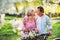 Beautiful senior couple with bicycles outside in spring nature.