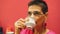 Beautiful senior woman drinking tea in white cup