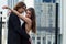 Beautiful sensual elegant couple stands on a city street and embraces