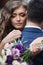 Beautiful sensual newlywed bride hugging handsome groom face closeup