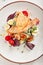 Beautiful serving white restaurant plate of caesar salad