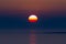 Beautiful setting sun in the dark sky at the Adriatic sea