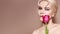Beautiful sexy Blonde Woman with luxury Make-up. Girl with Spring Flowers Bouquet. Style for Womans Day or Valentines