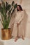 Beautiful sexy brunette woman face cosmetic makeup tanned skin wear fashion clothes style collection beige knitted suit sandals