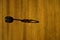 Beautiful shadow of key in keyhole on wooden door