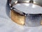 Beautiful shiny bracelet on white background. Bracelet pasted from gold and silver foil